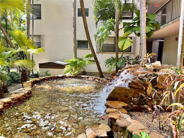 55 Ocean Lane Dr Unit 2030, Key Biscayne, FL 33149 - view of yard featuring a small pond and a balcony