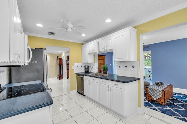 kitchen with decorative backsplash, sink, dishwasher, white cabinetry, and light tile patterned flooring