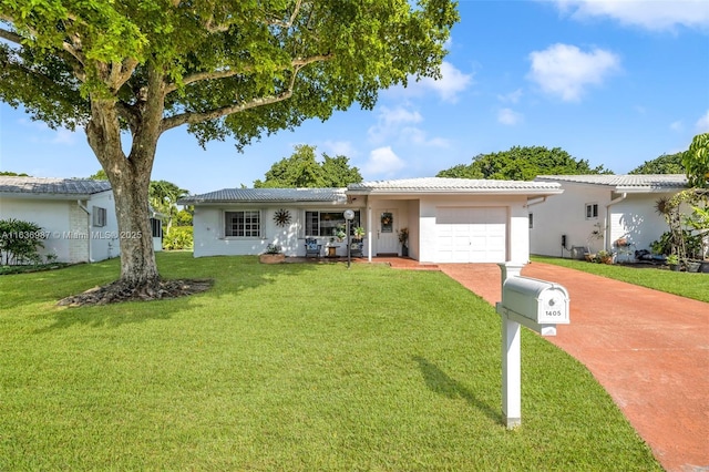 single story home with a garage and a front yard