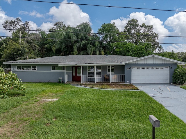 ranch-style home with a garage, covered porch, and a front lawn