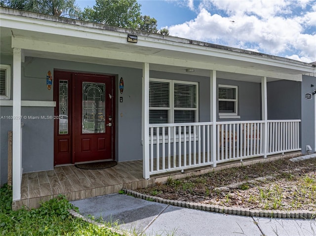 property entrance with a porch