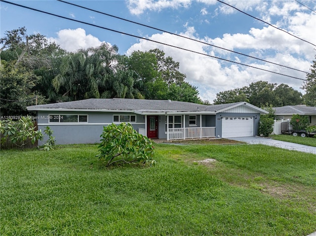 single story home featuring a garage and a front lawn