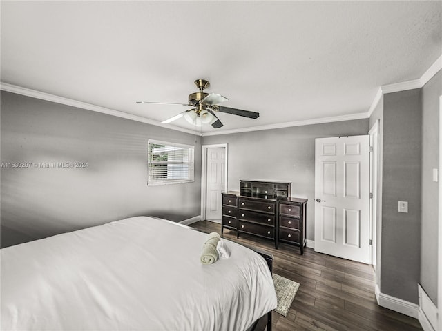 bedroom featuring crown molding, hardwood / wood-style floors, and ceiling fan