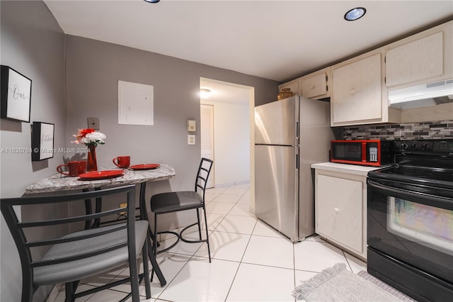 kitchen featuring black appliances, backsplash, and light tile patterned floors