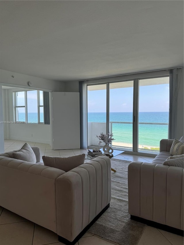 9195 Collins Ave Unit 801, Surfside, FL 33154 - tiled living area with a water view