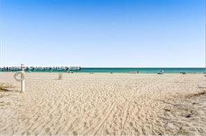 9195 Collins Ave Unit 801, Surfside, FL 33154 - property view of water featuring a beach view