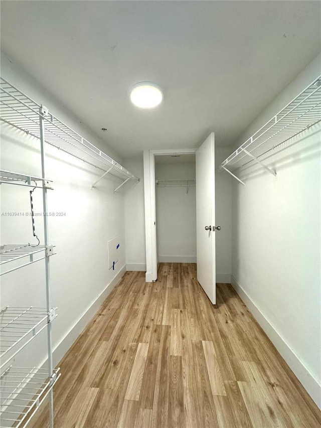 9195 Collins Ave Unit 801, Surfside, FL 33154 - spacious closet featuring light wood-style floors