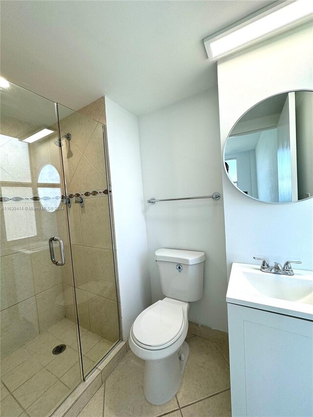 9195 Collins Ave Unit 801, Surfside, FL 33154 - full bathroom with vanity, tile patterned flooring, a stall shower, and toilet