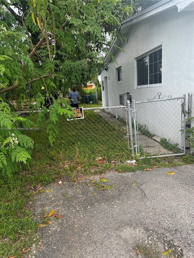 view of property exterior featuring fence and stucco siding