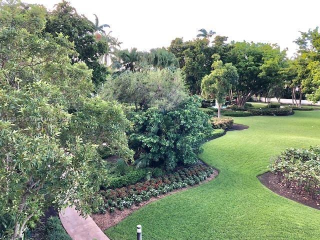 view of home's community featuring a lawn