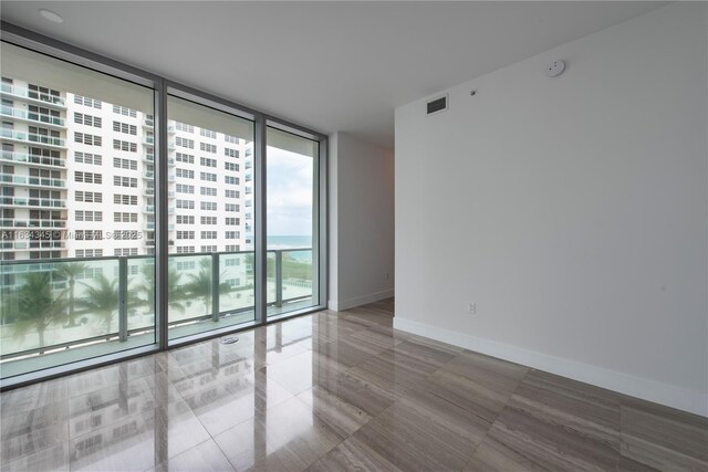 spare room with expansive windows