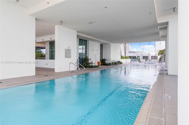 view of swimming pool featuring a patio