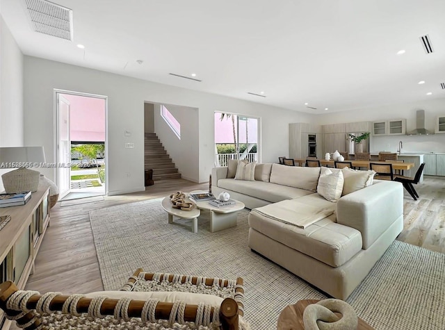 living room with light hardwood / wood-style flooring