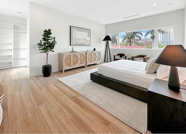 bedroom with light hardwood / wood-style flooring