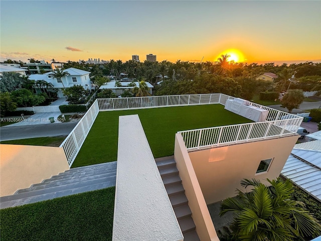 view of yard at dusk