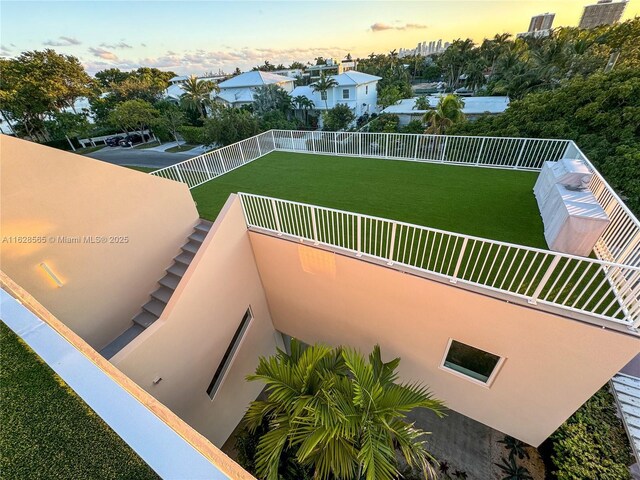 view of balcony at dusk