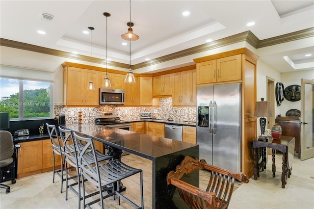 kitchen featuring stainless steel appliances, a raised ceiling, visible vents, and decorative backsplash