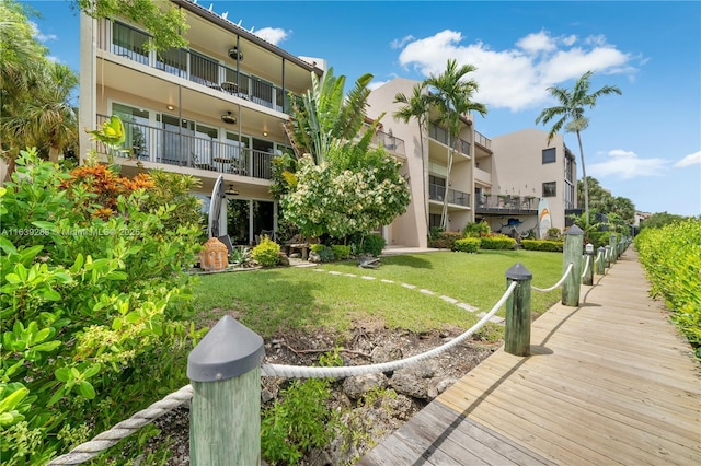 view of property's community with a lawn