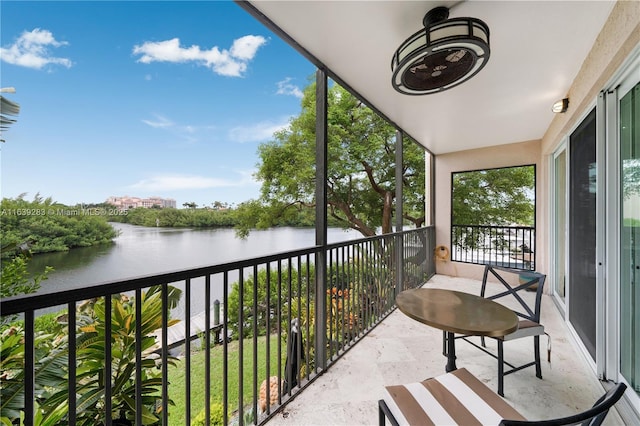 balcony featuring a water view