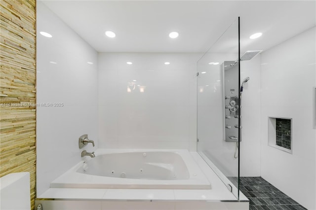 full bath with tiled shower, a jetted tub, and toilet