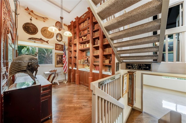 interior space with a chandelier and wood finished floors