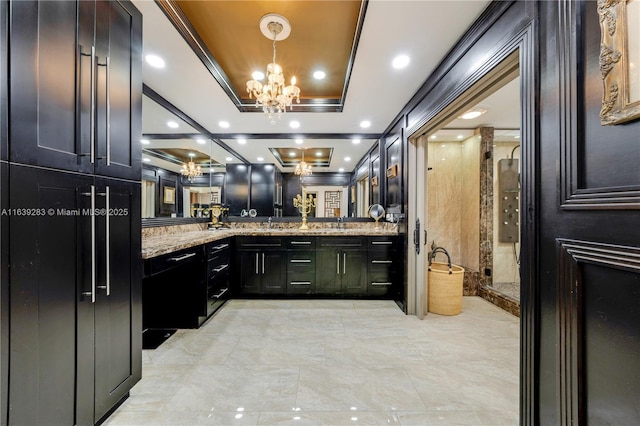 full bathroom featuring a chandelier, recessed lighting, a shower stall, double vanity, and a raised ceiling