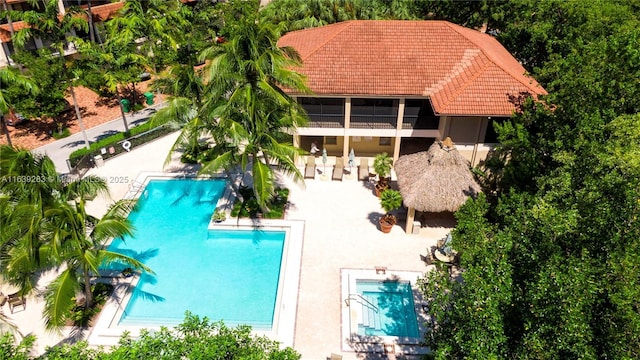 community pool featuring a patio area