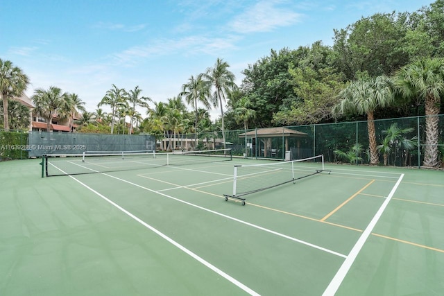 view of sport court with fence