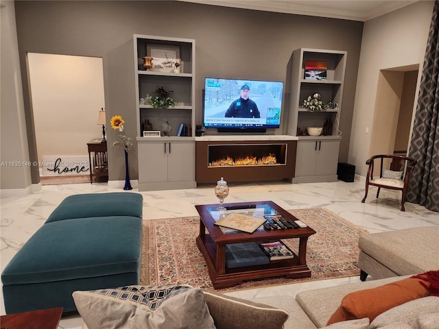 living room with built in shelves and ornamental molding