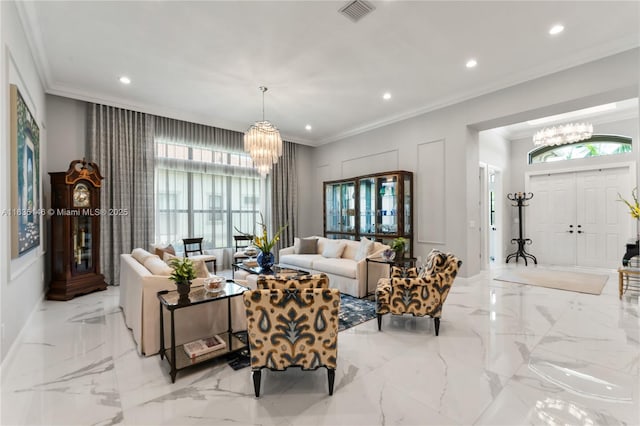 living room with a wealth of natural light, crown molding, and an inviting chandelier