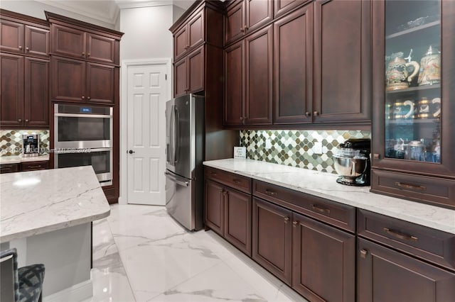 kitchen with light stone counters, crown molding, backsplash, and appliances with stainless steel finishes