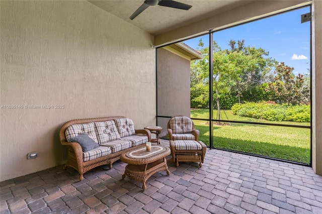 sunroom with ceiling fan