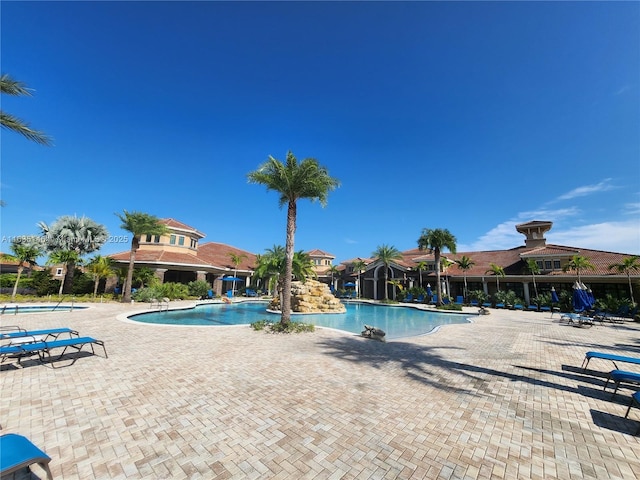 view of swimming pool with a patio area