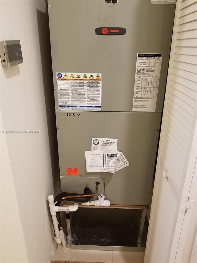 utility room featuring heating unit