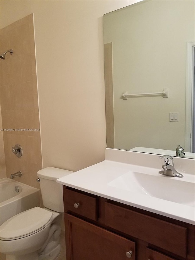 full bathroom with vanity, toilet, and tiled shower / bath