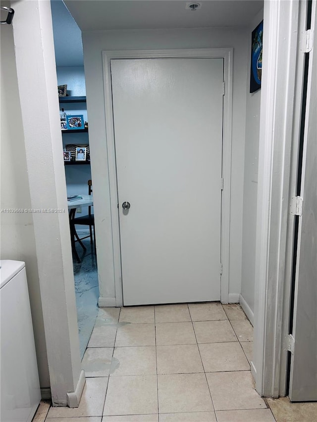 hallway with light tile patterned floors