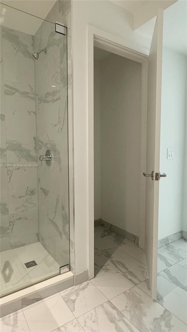 bathroom with tiled shower