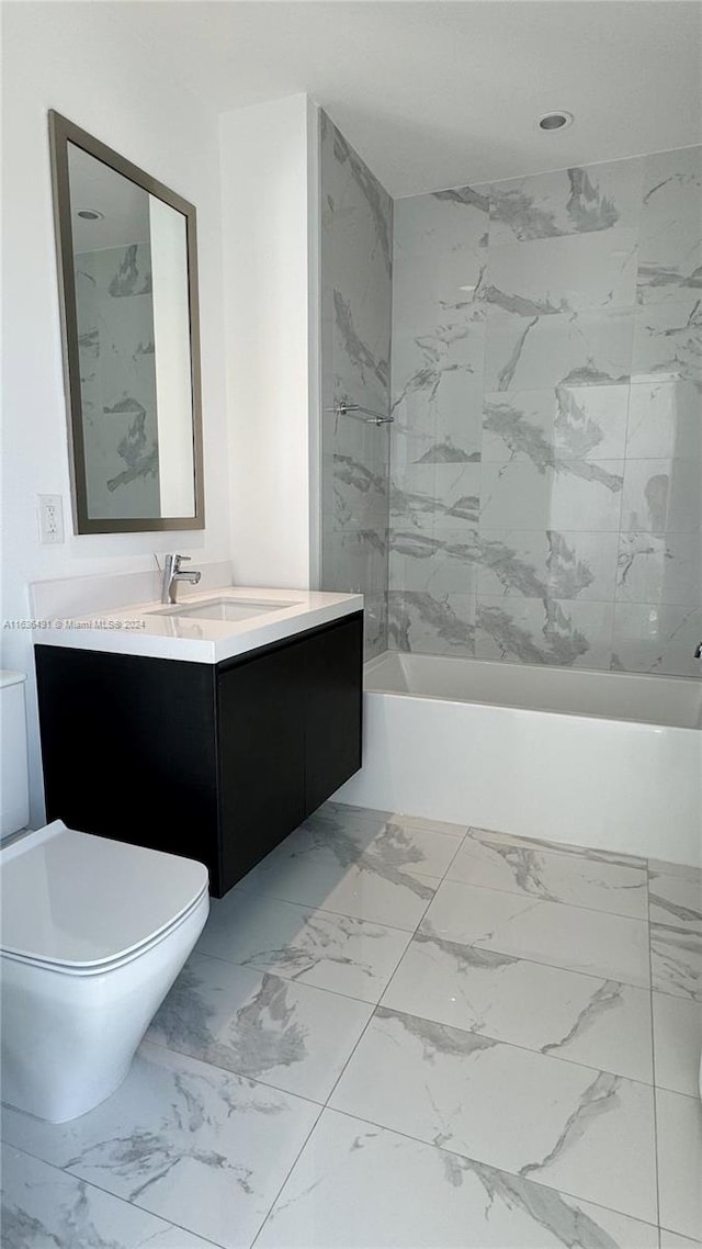 full bathroom with vanity, toilet, and tiled shower / bath combo