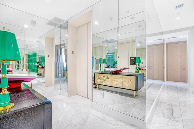 bathroom with tile patterned floors and vanity