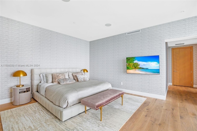 bedroom with light hardwood / wood-style floors