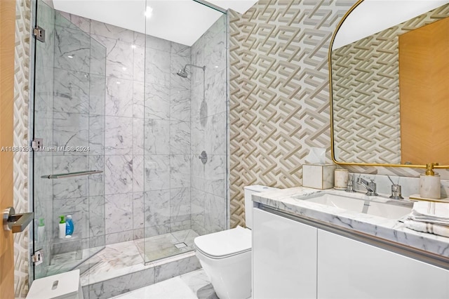 bathroom with tile walls, toilet, and vanity