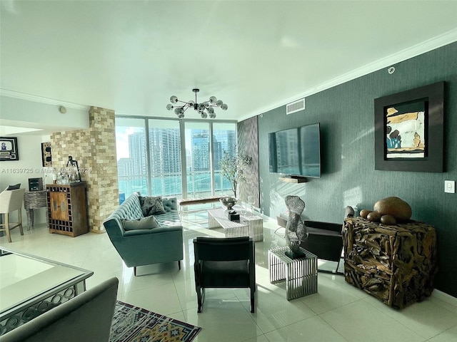 living room featuring ornamental molding, tile patterned flooring, and an inviting chandelier