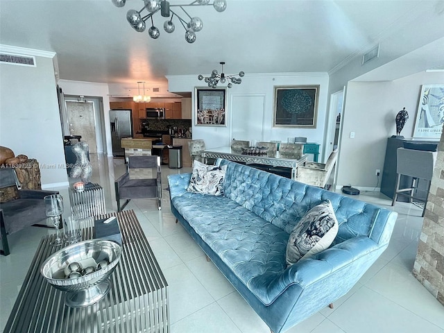 tiled living room with ornamental molding and an inviting chandelier