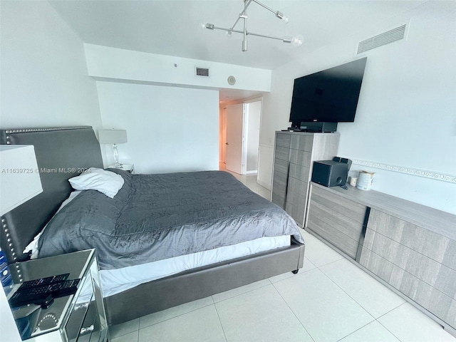 bedroom featuring light tile patterned flooring