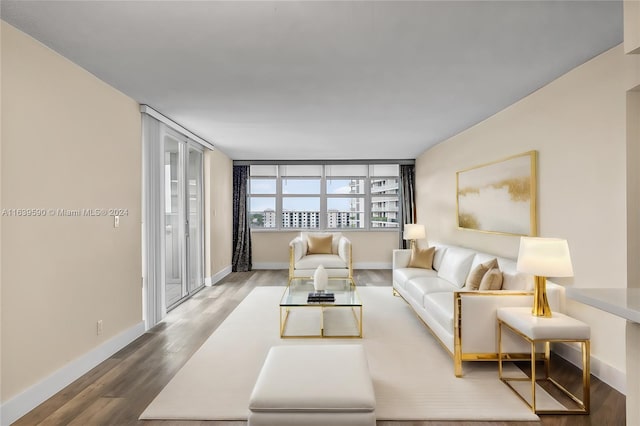 living room featuring baseboards and wood finished floors