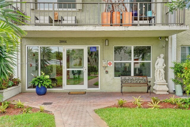 doorway to property featuring a balcony