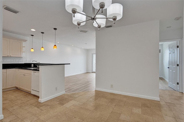 kitchen featuring sink, an inviting chandelier, white dishwasher, decorative backsplash, and decorative light fixtures