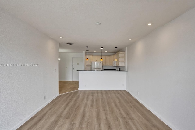 unfurnished living room featuring light wood-type flooring