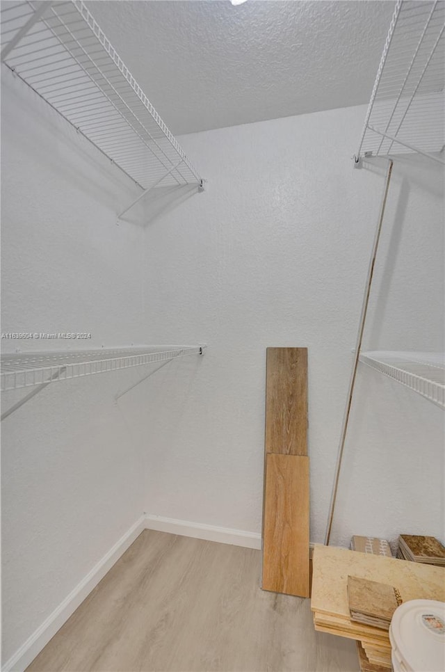 walk in closet featuring wood-type flooring