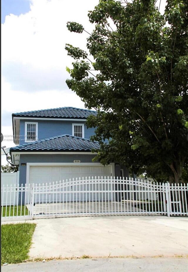 view of front of home with a garage